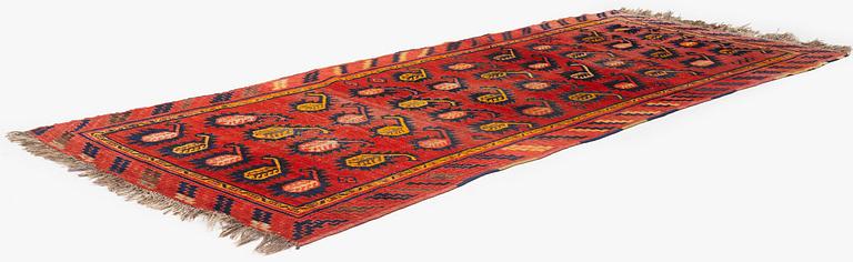 An antique Central Asian carpet, possibly Kirghiz, c. 346 x 154 cm.