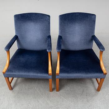 A mid 20th Century pair of oak armchairs attributed to Carl Malmsten.
