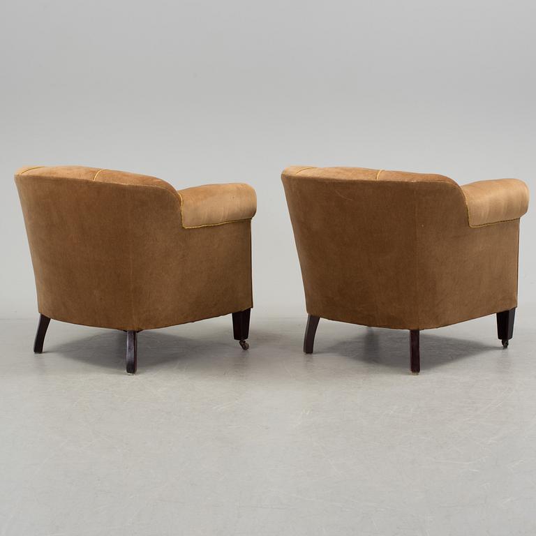 A pair 20th century club chairs.