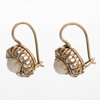 A pair of 14K gold earrings with cultured halfpearls and rose-cut diamonds.