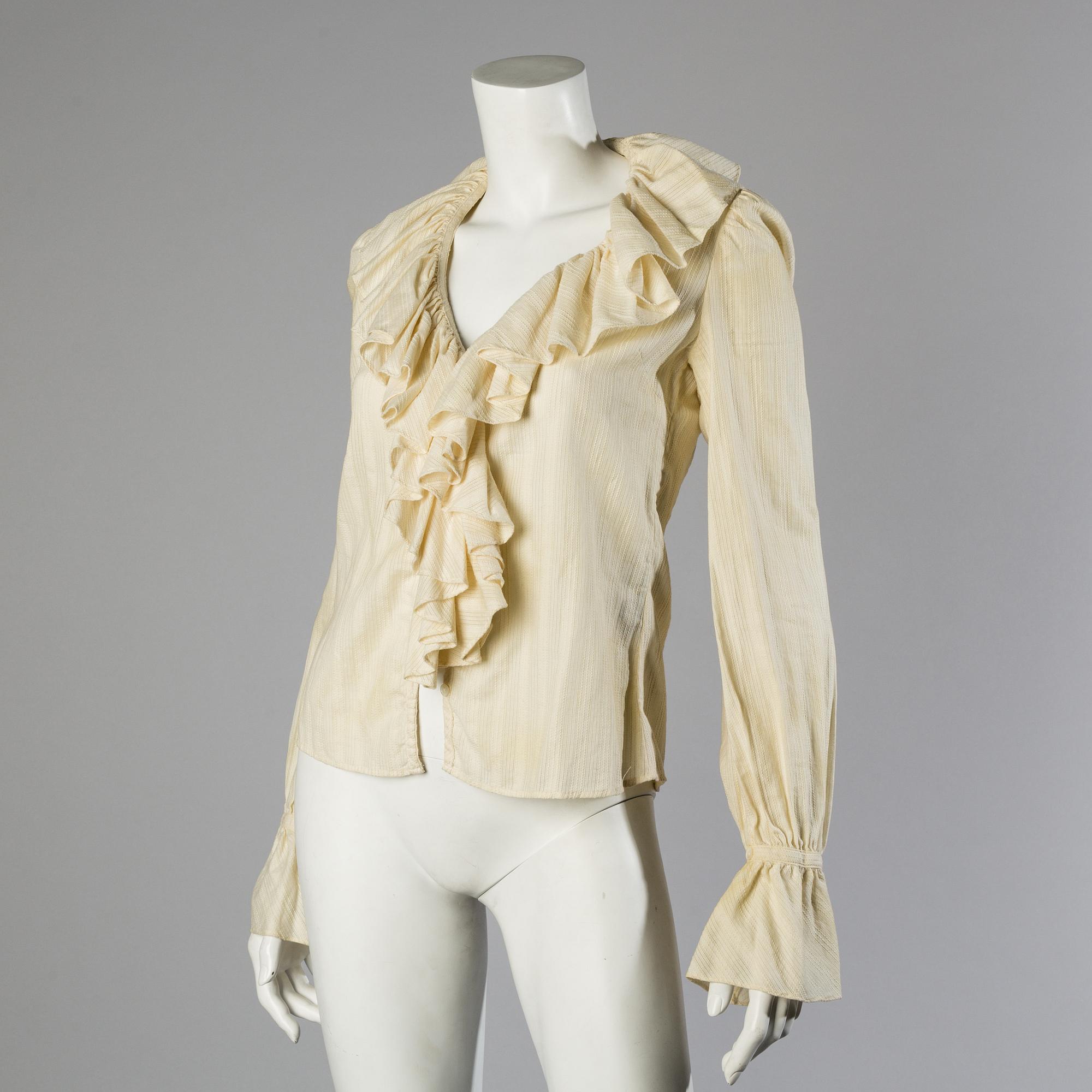 A wool/alpaca jacket by Ralph Lauren and two blouses.