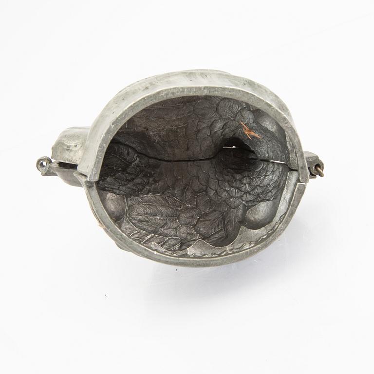 A set of four pewter icecream moulds around 1900.