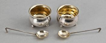 A PAIR OF RUSSIAN PARCEL-GILT SALTS AND SPOONS, Makers mark of Chlebnikow, Moscow 1896.
