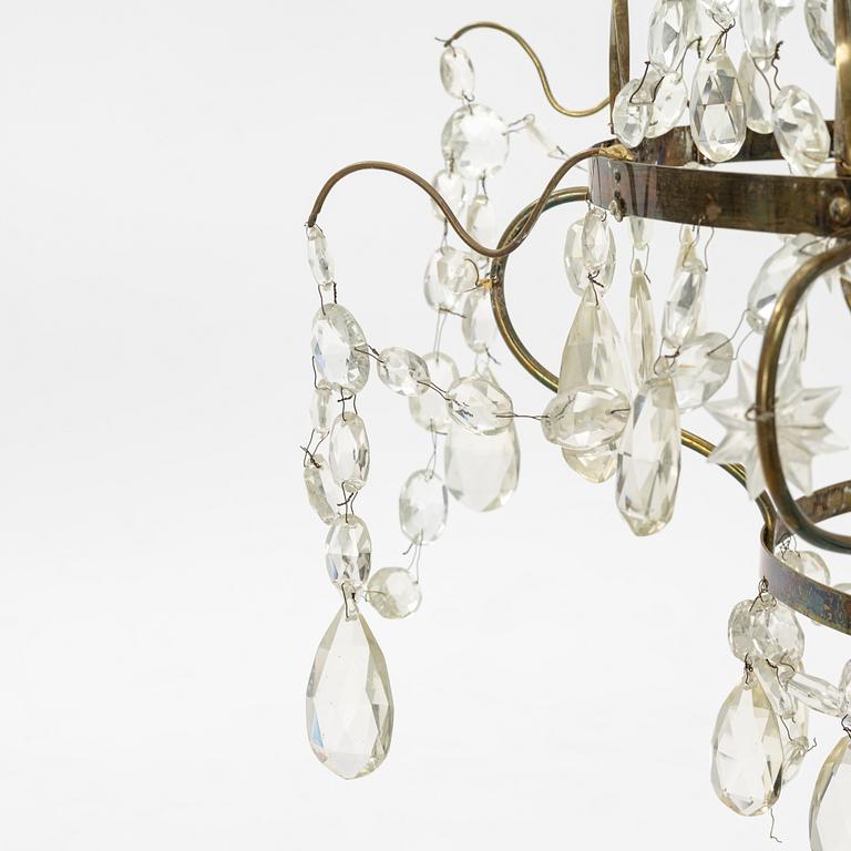 A three-light Gustavian-style hanging light, circa 1900.