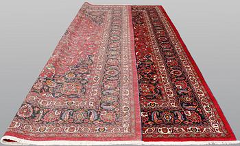 A signed Mashad carpet, ca 375 x 303 cm.