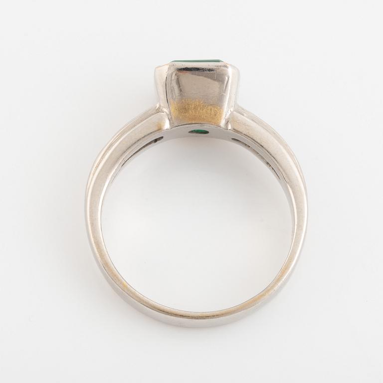 Emeralt cut emerald and brilliant cut diamond ring.