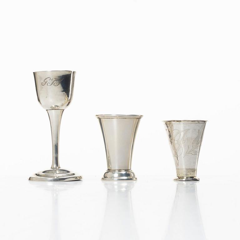 A Swedish silver cup and two beakers.