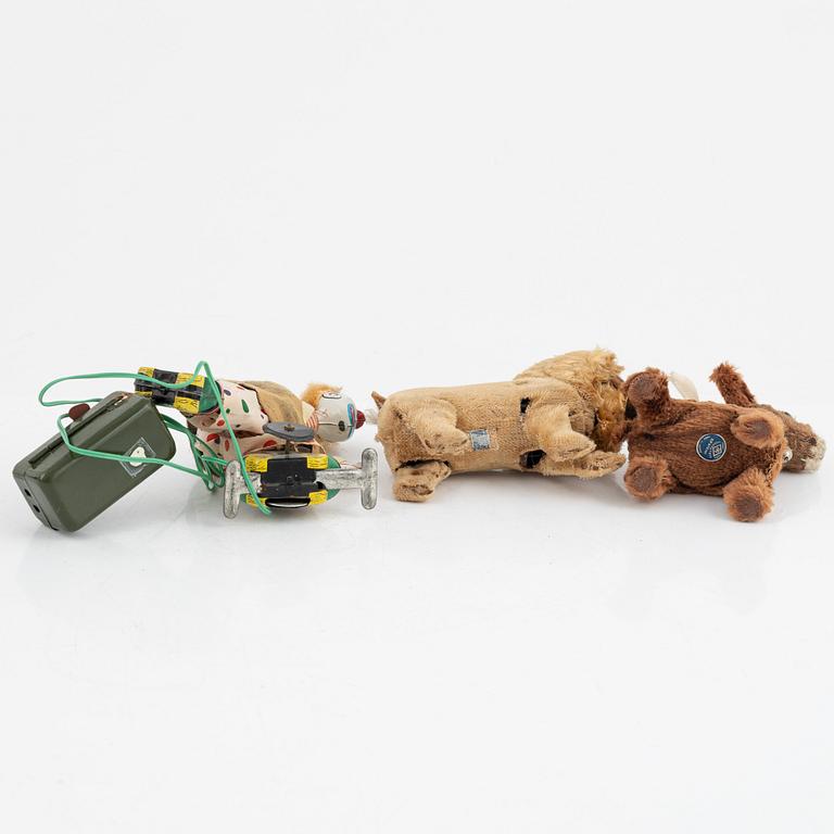 A set of five toys, including 'Rolly' clown from Schuco, 20th century.