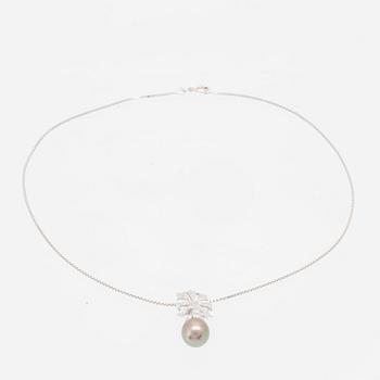 An 18K white gold necklace set with a drop-shaped cultured pearl and round brilliant-cut diamonds.
