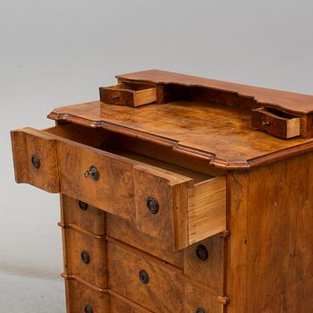 a walnur chest of drawers from the mid 1800's.