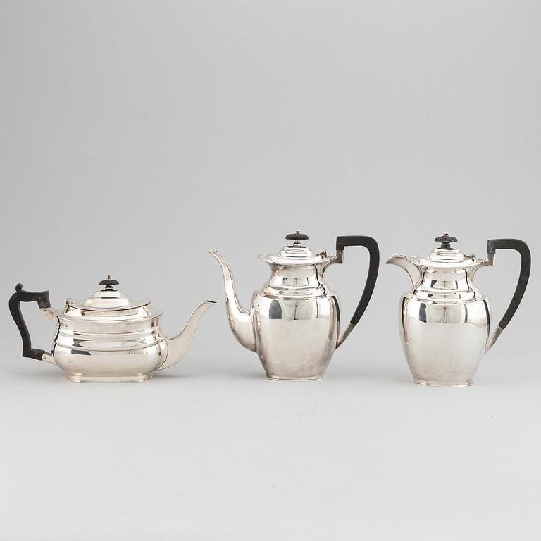 A silver teapot, coffee pot and a hot water pot, including Atkins Brothers, Sheffield 1944.