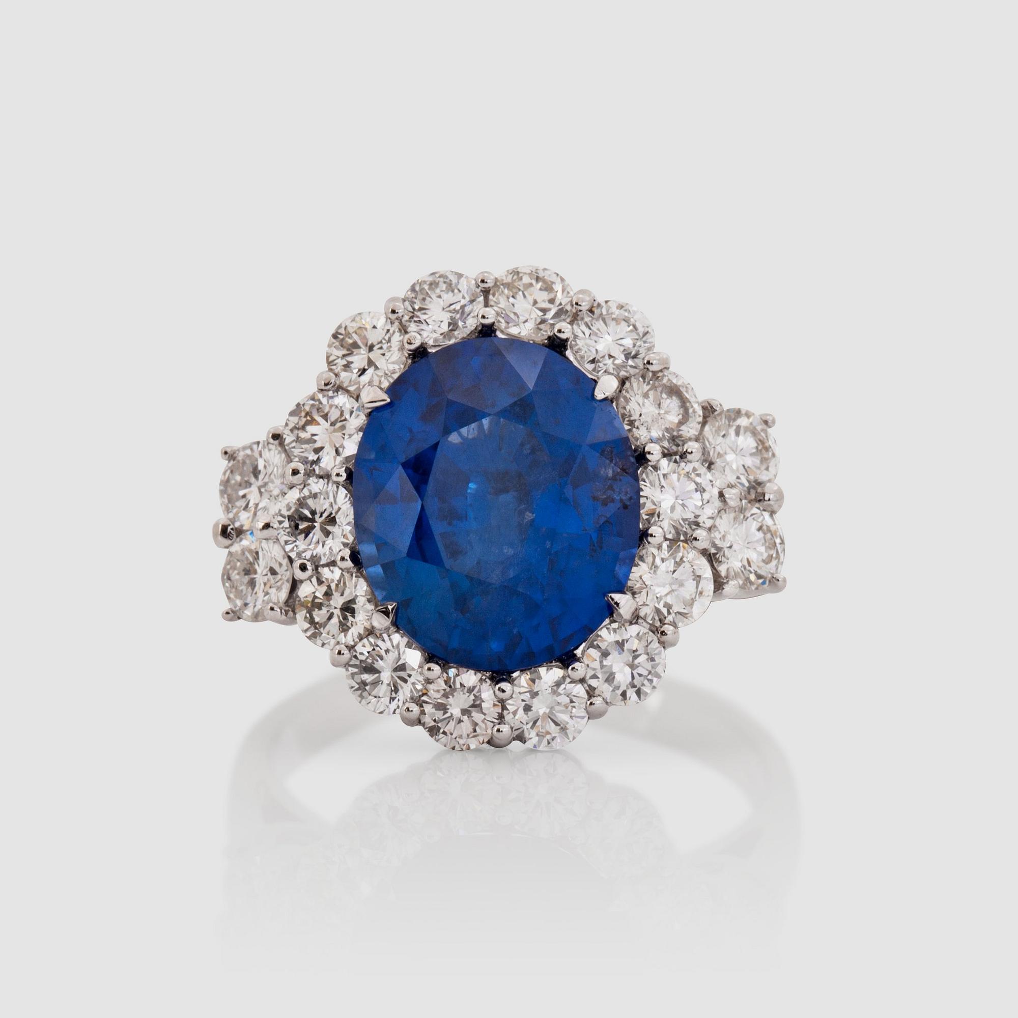A 5.74 cts sapphire and diamond ring. Total carat weight 1.70 cts.