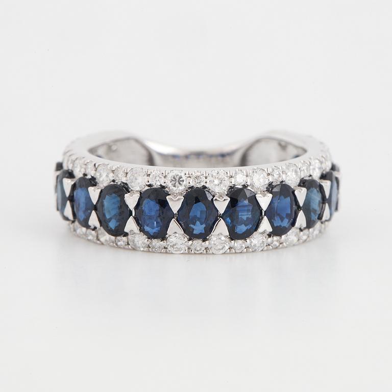 Oval sapphire and brilliant-cut diamond ring.