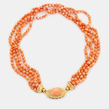 496. A four strand coral necklace with an 18K gold clasp set with coral and round brilliant-cut diamonds.