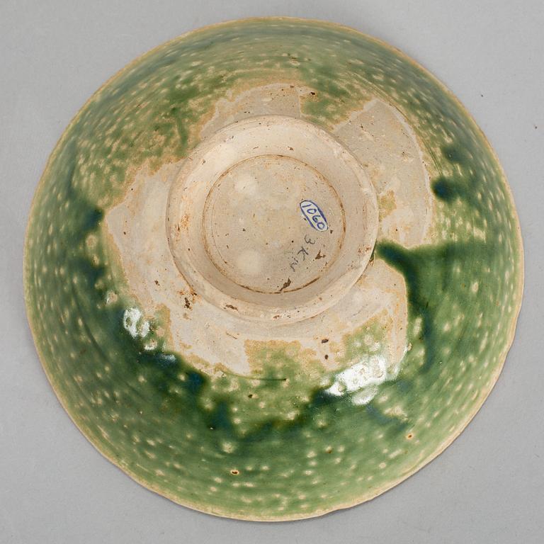 A set of two green glazed dishes, and a bowl, South East Asia 15th/16th Century.