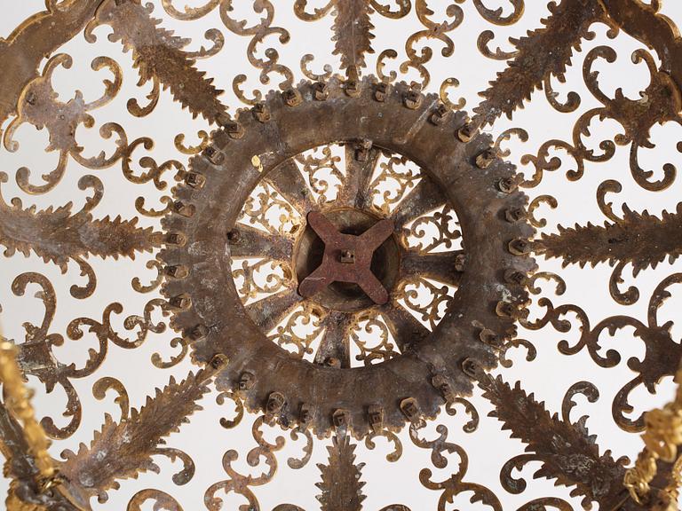 A rococo-revival gilt-brass sixteen-light chandelier, mid 19th century.