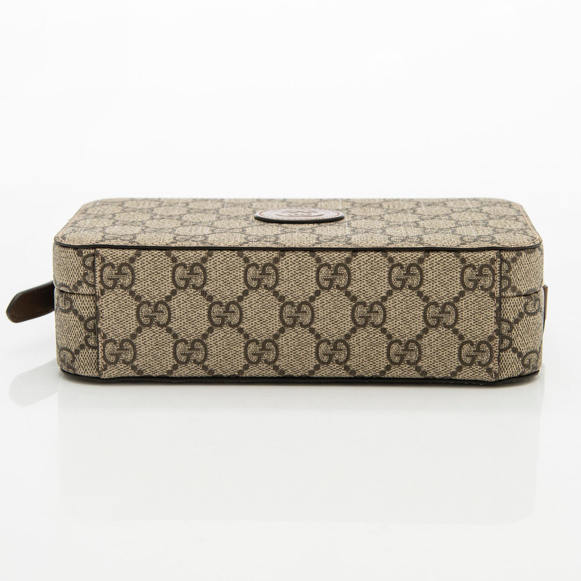 Gucci, "GG Supreme" laukku.