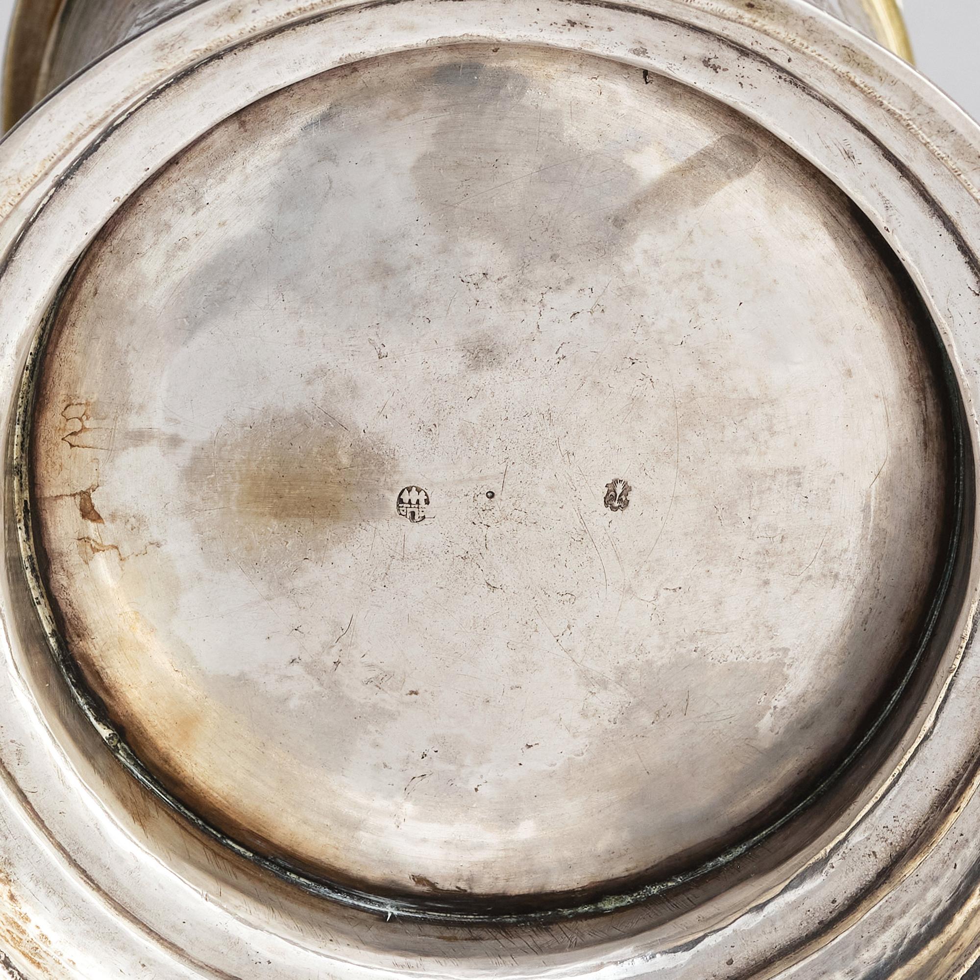 A German parcel-gilt silver tankard, mark of Walter Kopman, Hamburg (1649-1688).