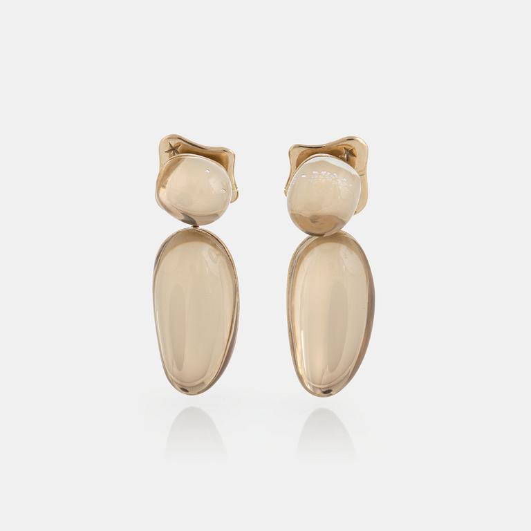 A pair of 18K gold H Stern earrings set with cabochon-cut rock crystal.