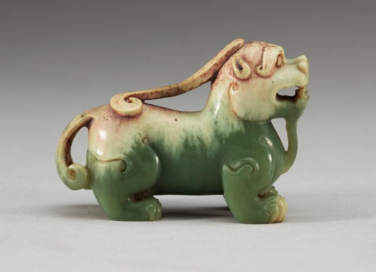A carved nephrite figure of an archaistic buddhist lion, Qing dynasty.