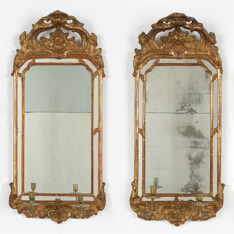 A pair of Swedish rococo two-light girandole mirrors, later part 18th century.