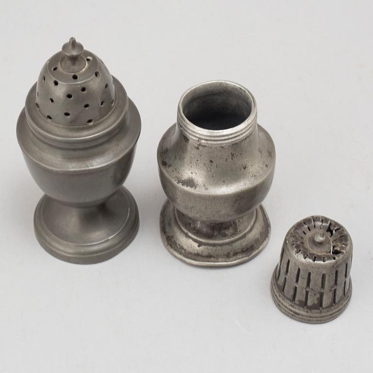 Two 18th century pewter shakers.