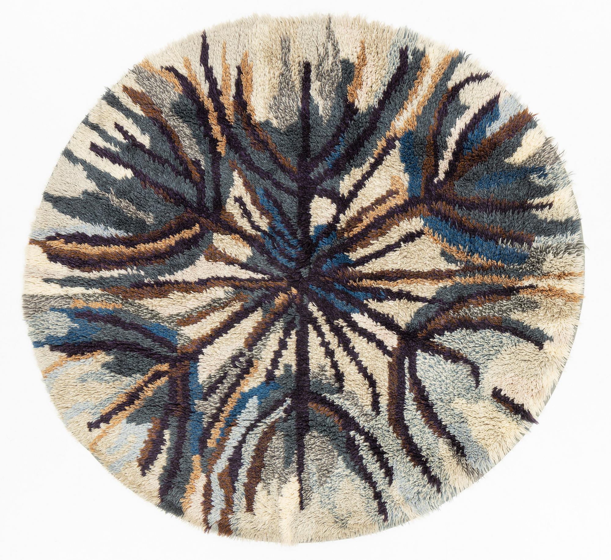 A knotted pile (rya) rug, diameter  180 - 190 cm.