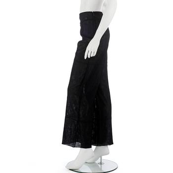 CHANEL, a black mesh evening pant.