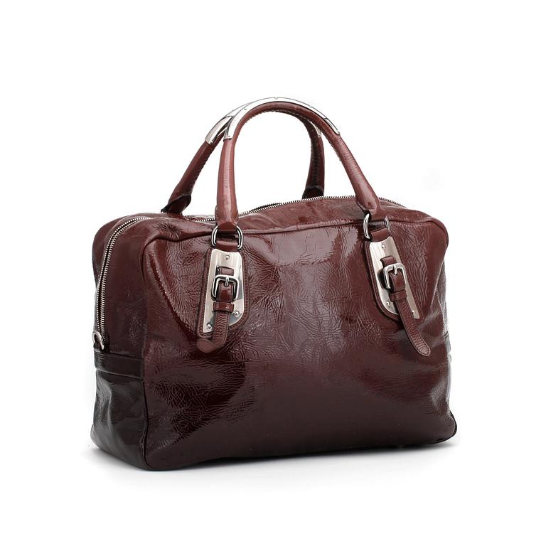 PRADA, a brown leather glace zipper bag.