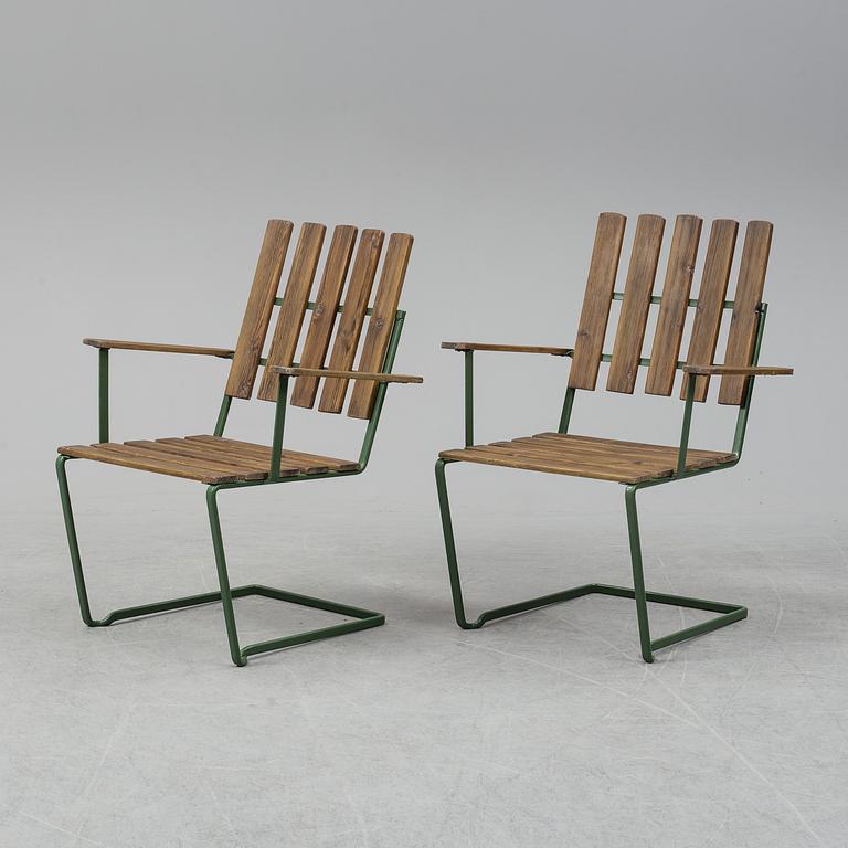 A pair of model A" armchairs from Grythyttan Stålmöbler.