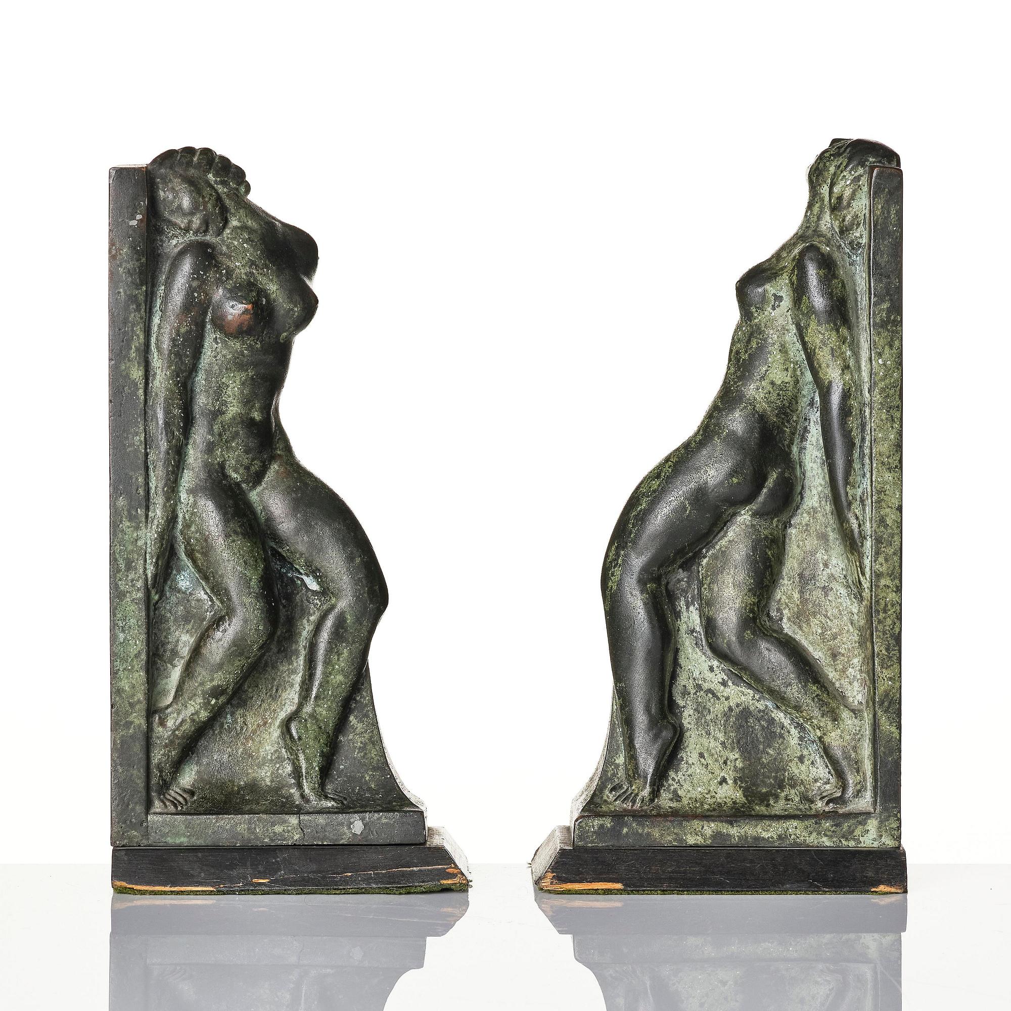 Axel Gute, a pair of Swedish Grace patinated bronze bookends, 1920s.