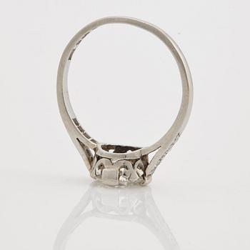 A ring set with an old-cut diamond.