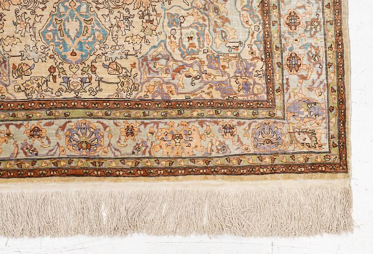 An oriental, silk rug, signed, c. 175 x 125 cm.