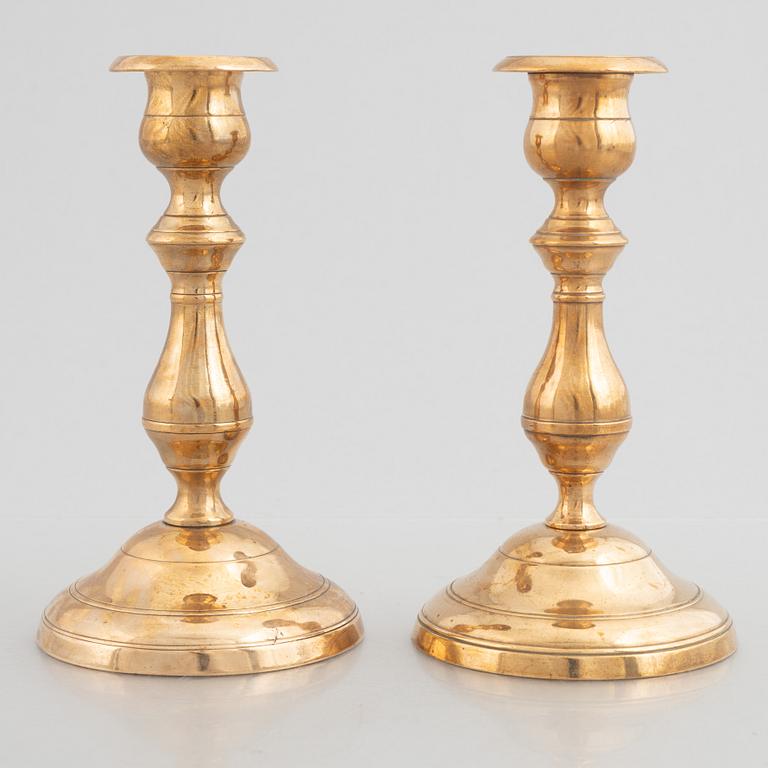 Skultuna Messinsbruk, two pairs of brass candlesticks, 19th century.