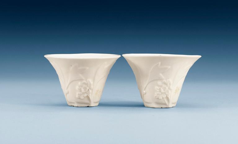 A pair of blanc de chine libation cups, Qing dynasty, Qianlong (1736-95). (2).