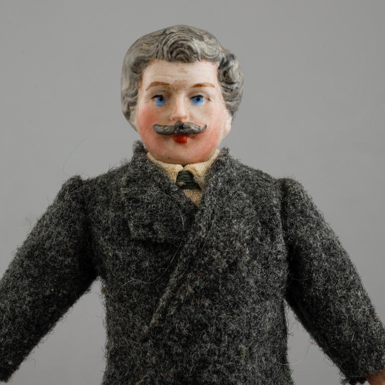 Eight small dolls from the early 20th century.