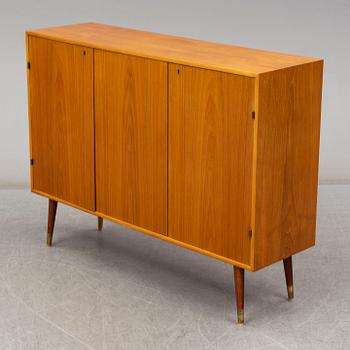 A late 20th Century teak veneered sideboard.