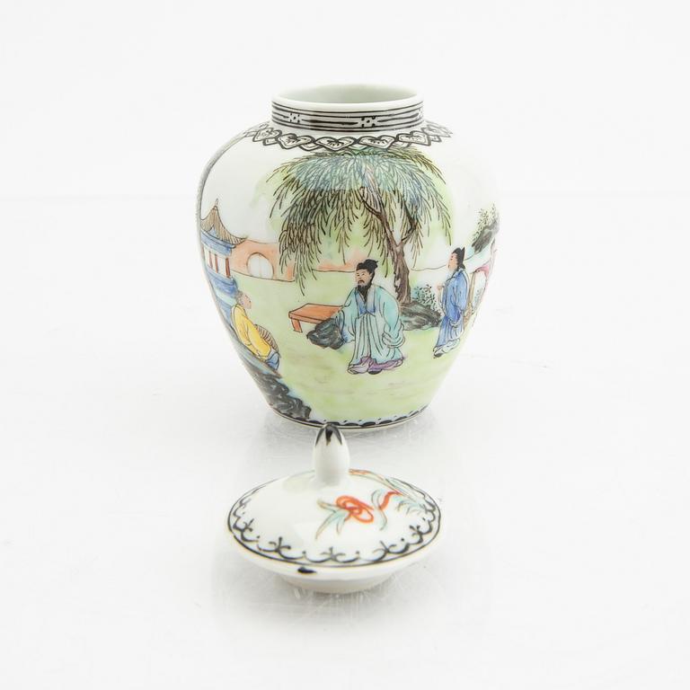 A Chinese 20th century Yixing ware tea service and a porcelain tea caddie.