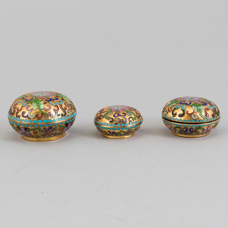 Three small boxes, two eggs and a bell, enamel, probably China, second half of th 20th century.
