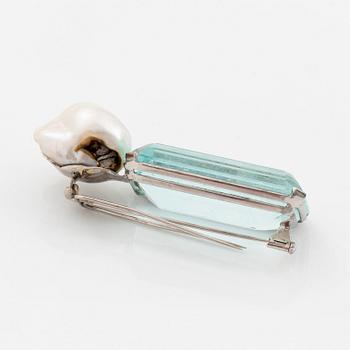 A Tina Karlsson a brooch in 18K white gold set with a large step-cut aquamarine and a cultured pearl.