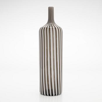 Gio Ponti, a glass bottle '4500' signed Venini, Murano and three drinking glasses, Italy.