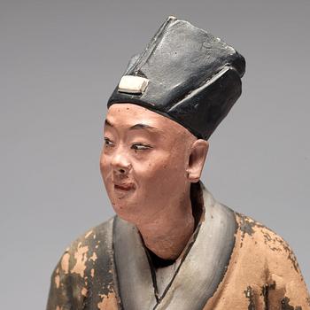 A clay figure of a chinese man, Qing dynasty, 19th Century.