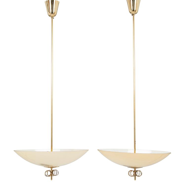 Paavo Tynell, a pair of mid-20th century pendant lights for Idman.