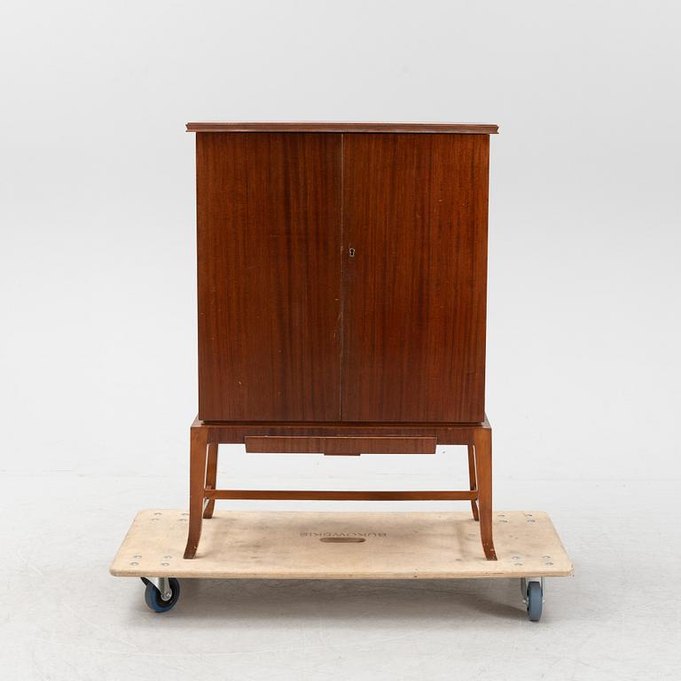 A mahogany veneered drinks cabinet, mid 20th Century.