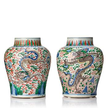 A matched pair of Transitional Wucai jars, 17th Century.