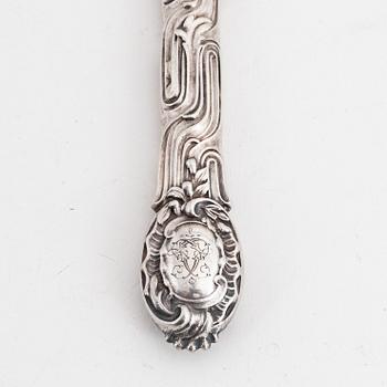 Twelve Swedish rococo-revival silver knives, mark of Christian Hammer, Stockholm 1857-1880.