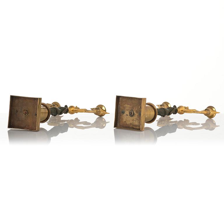 A pair of Swedish Empire ormolu and patinated two-branch candelabra, Stockholm, early 19th century.
