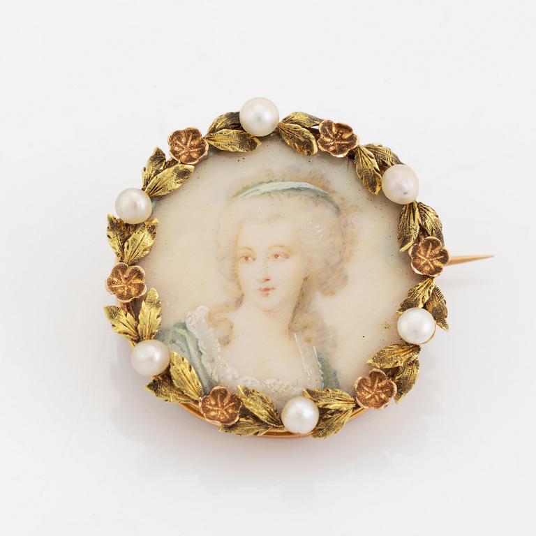 Brooch with miniature portrait on mother of pearl.