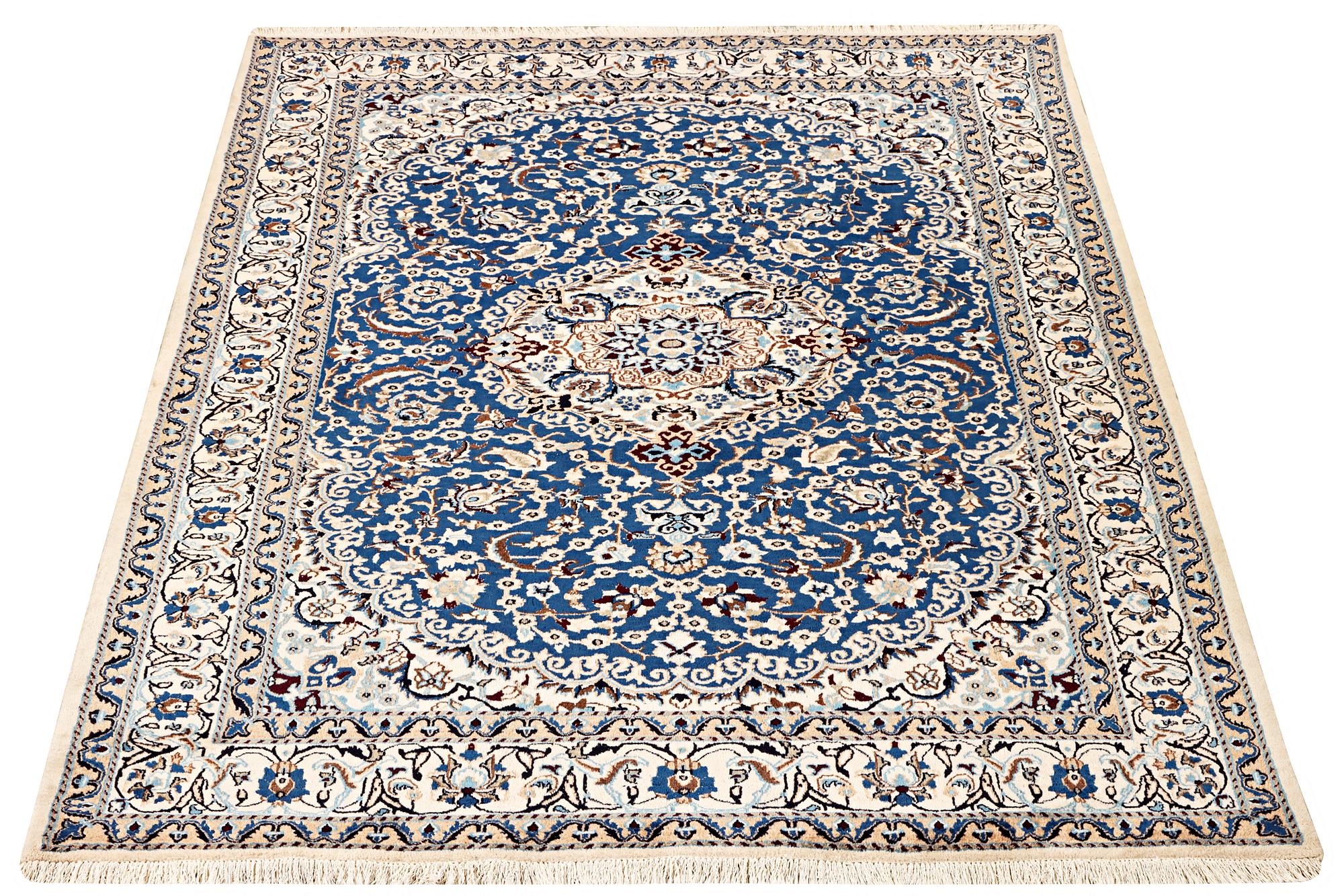 A Nain carpet, part silk, 9 laa, c. 300 x 189 cm.