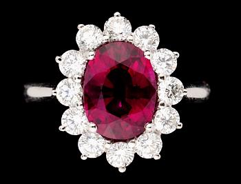 728. A gold, rubellite and diamond ring.